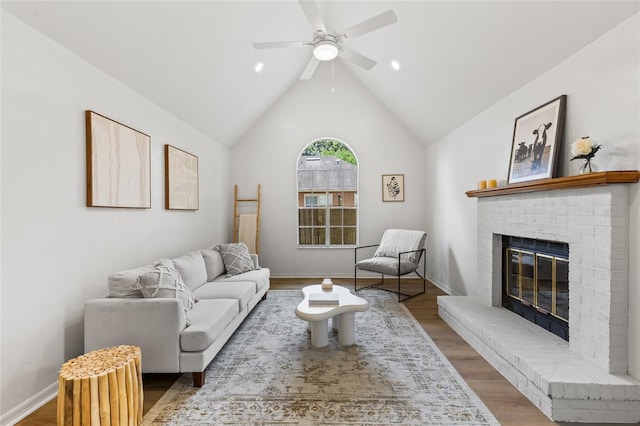 10943 NW 34th Pl, Gainesville, FL 32606 - living room with wood finished floors, a fireplace, a ceiling fan, vaulted ceiling, and recessed lighting