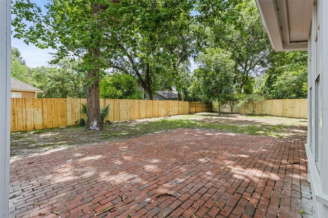 10943 NW 34th Pl, Gainesville, FL 32606 - fenced backyard featuring a patio