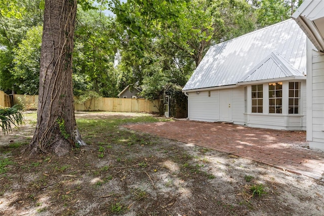 10943 NW 34th Pl, Gainesville, FL 32606 - fenced backyard with a patio area
