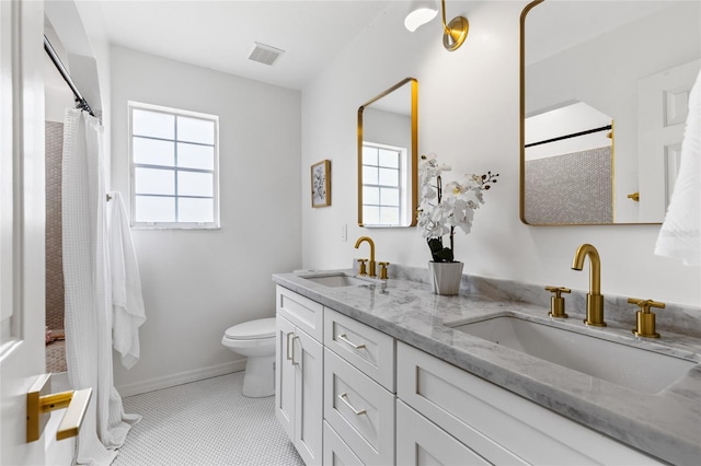 10943 NW 34th Pl, Gainesville, FL 32606 - full bath with double vanity and a shower with shower curtain