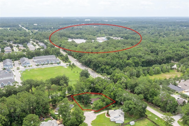 9911 NW 24th Pl, Gainesville, FL 32606 - aerial perspective of suburban area with a forest and property boundaries highlighted