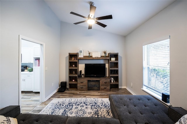 9911 NW 24th Pl, Gainesville, FL 32606 - living room featuring wood finished floors, ceiling fan, and high vaulted ceiling