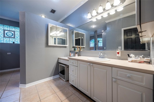 9911 NW 24th Pl, Gainesville, FL 32606 - bathroom with ornamental molding, tile patterned flooring, and vanity