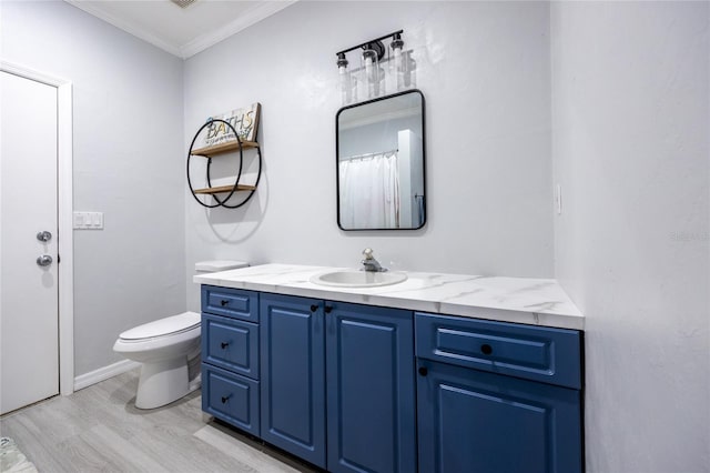 9911 NW 24th Pl, Gainesville, FL 32606 - bathroom featuring vanity, wood finished floors, and crown molding