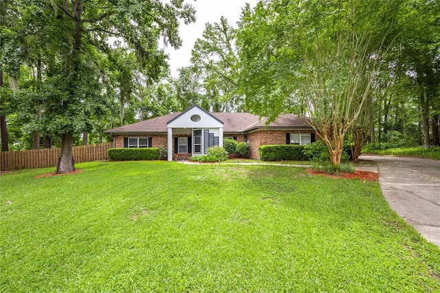 9911 NW 24th Pl, Gainesville, FL 32606 - view of front of property featuring brick siding and driveway