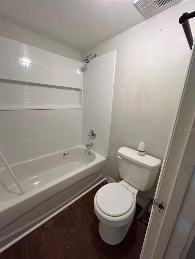 2811 SW Archer Rd Unit X203, Gainesville, FL 32608 - bathroom featuring shower / bath combination and wood finished floors