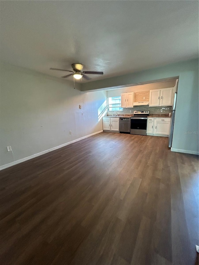 2811 SW Archer Rd Unit X203, Gainesville, FL 32608 - unfurnished living room featuring dark wood-style floors and a ceiling fan