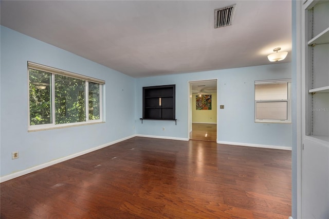 1814 NE 7th St, Gainesville, FL 32609 - spare room with wood finished floors and built in features