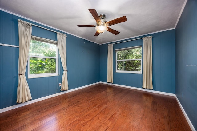 1814 NE 7th St, Gainesville, FL 32609 - empty room featuring wood finished floors, ceiling fan, and crown molding