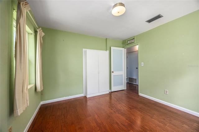1814 NE 7th St, Gainesville, FL 32609 - unfurnished bedroom with wood finished floors and baseboards