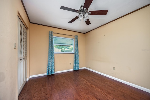 1814 NE 7th St, Gainesville, FL 32609 - unfurnished bedroom featuring wood finished floors, a closet, ornamental molding, and a ceiling fan