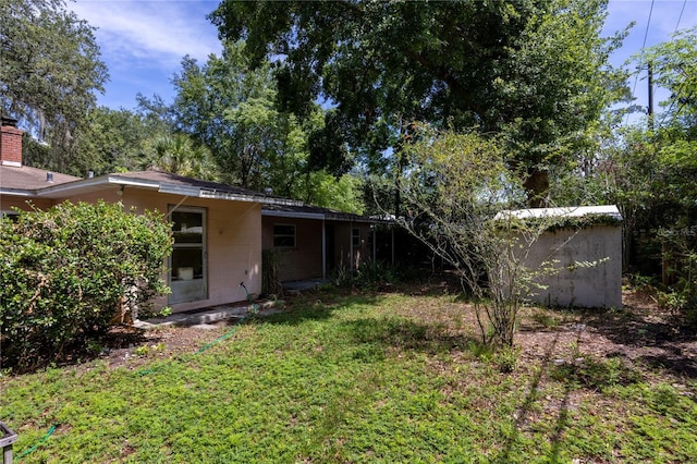 1814 NE 7th St, Gainesville, FL 32609 - view of green lawn featuring a shed