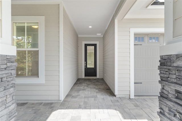 11890 SW 33rd Ln, Gainesville, FL 32608 - doorway to property with a garage