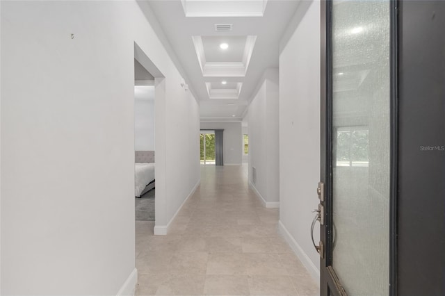 11890 SW 33rd Ln, Gainesville, FL 32608 - hallway featuring a tray ceiling, recessed lighting, and light tile patterned floors