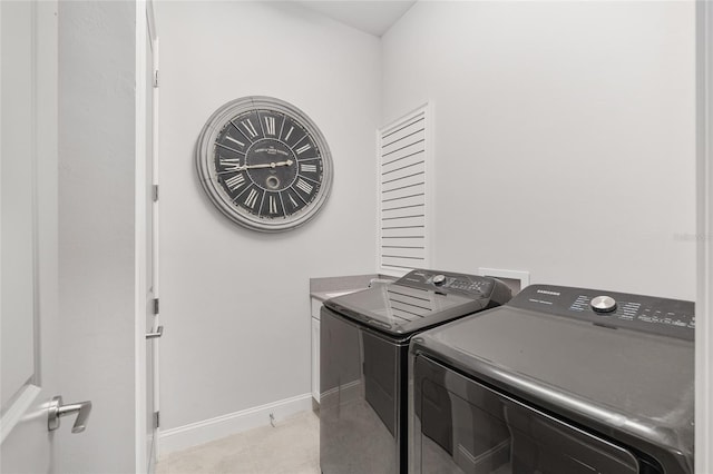 11890 SW 33rd Ln, Gainesville, FL 32608 - laundry room with washer and dryer and light tile patterned floors