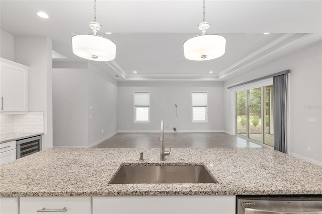 11890 SW 33rd Ln, Gainesville, FL 32608 - kitchen with open floor plan, dishwasher, a tray ceiling, recessed lighting, and healthy amount of natural light