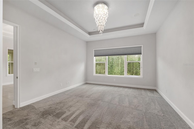 11890 SW 33rd Ln, Gainesville, FL 32608 - carpeted spare room with a chandelier and a raised ceiling