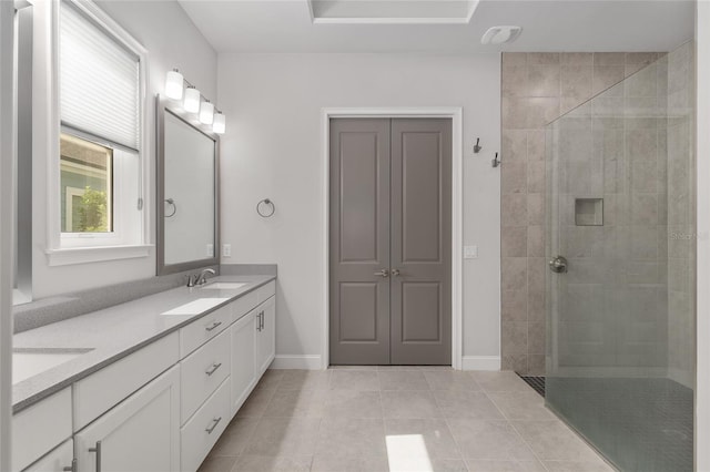 11890 SW 33rd Ln, Gainesville, FL 32608 - bathroom with double vanity, tiled shower, and tile patterned floors