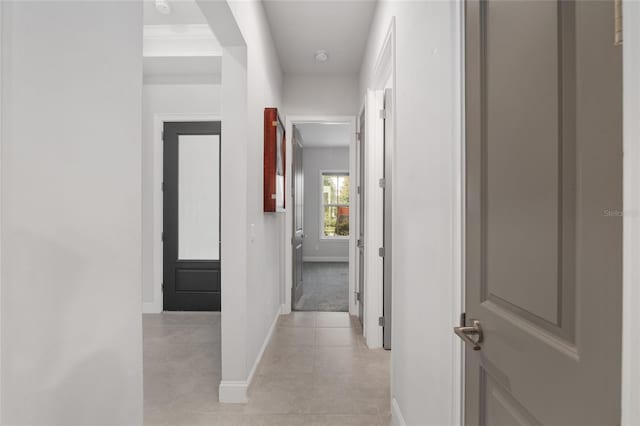 11890 SW 33rd Ln, Gainesville, FL 32608 - hallway featuring light tile patterned flooring and baseboards