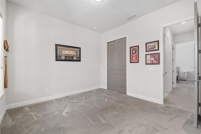 11890 SW 33rd Ln, Gainesville, FL 32608 - unfurnished bedroom with carpet floors and baseboards