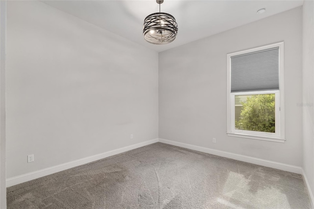 11890 SW 33rd Ln, Gainesville, FL 32608 - unfurnished room with a chandelier and carpet flooring