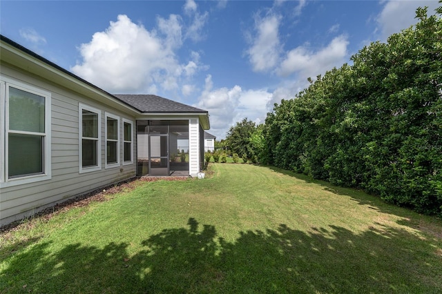 11890 SW 33rd Ln, Gainesville, FL 32608 - view of grassy yard featuring a sunroom