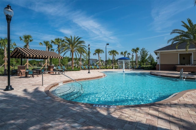 11890 SW 33rd Ln, Gainesville, FL 32608 - community pool featuring a patio