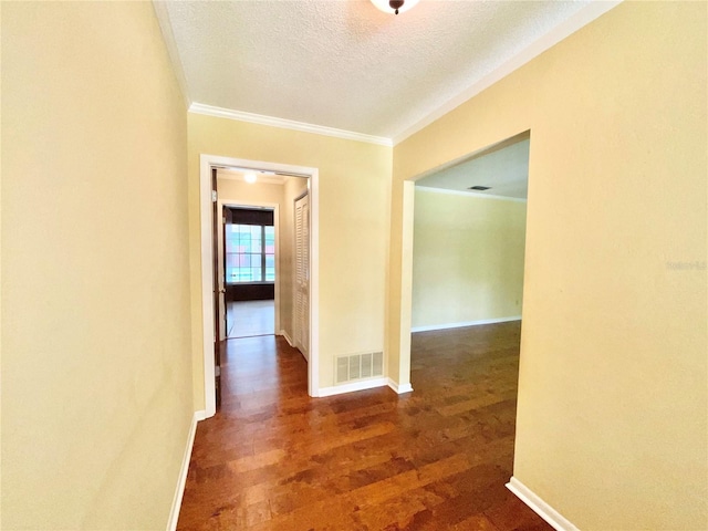 2268 NW 17th Ave, Gainesville, FL 32605 - hall with ornamental molding, wood finished floors, and a textured ceiling