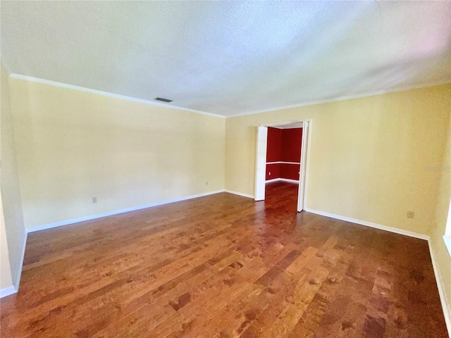 2268 NW 17th Ave, Gainesville, FL 32605 - empty room with wood finished floors and crown molding