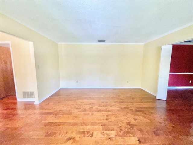 2268 NW 17th Ave, Gainesville, FL 32605 - empty room featuring crown molding and wood finished floors
