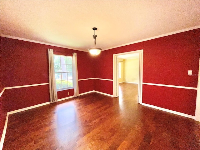 2268 NW 17th Ave, Gainesville, FL 32605 - spare room with wood finished floors and crown molding