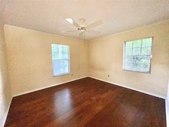 2268 NW 17th Ave, Gainesville, FL 32605 - spare room with dark wood-style flooring and a ceiling fan