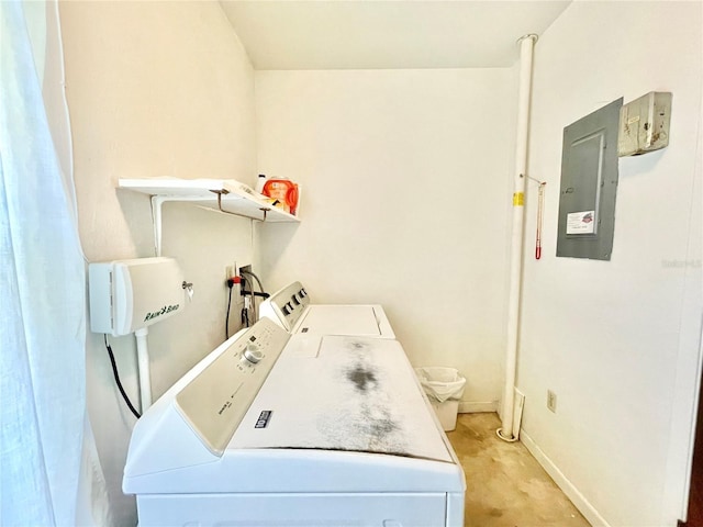 2268 NW 17th Ave, Gainesville, FL 32605 - washroom with washing machine and clothes dryer, electric panel, and light carpet