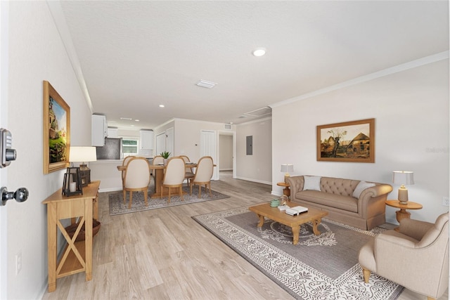 9011 N Travis Dr, Citrus Springs, FL 34434 - living room with ornamental molding, light wood-style flooring, electric panel, and recessed lighting