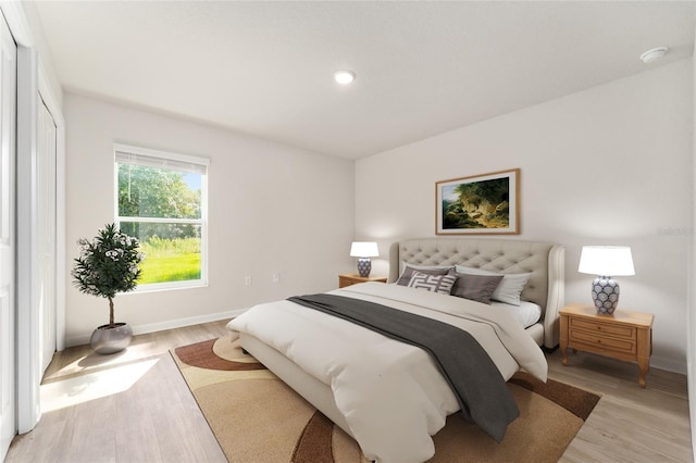 9011 N Travis Dr, Citrus Springs, FL 34434 - bedroom featuring light wood-style flooring and recessed lighting