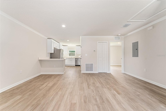 9011 N Travis Dr, Citrus Springs, FL 34434 - unfurnished living room with electric panel, crown molding, light wood finished floors, and recessed lighting