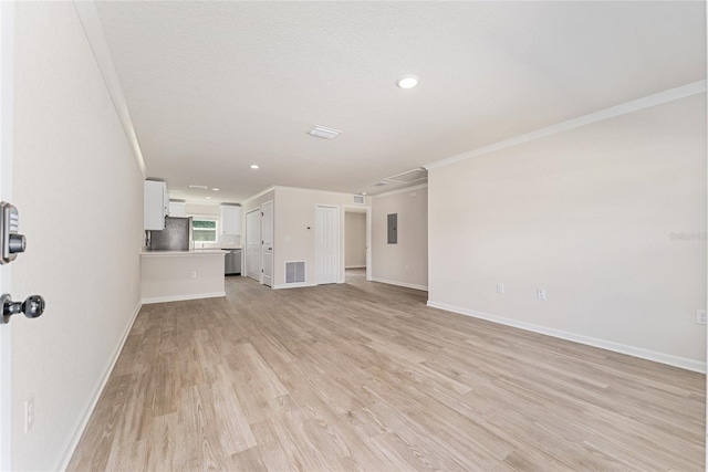 9011 N Travis Dr, Citrus Springs, FL 34434 - unfurnished living room featuring crown molding, light wood-type flooring, electric panel, and recessed lighting