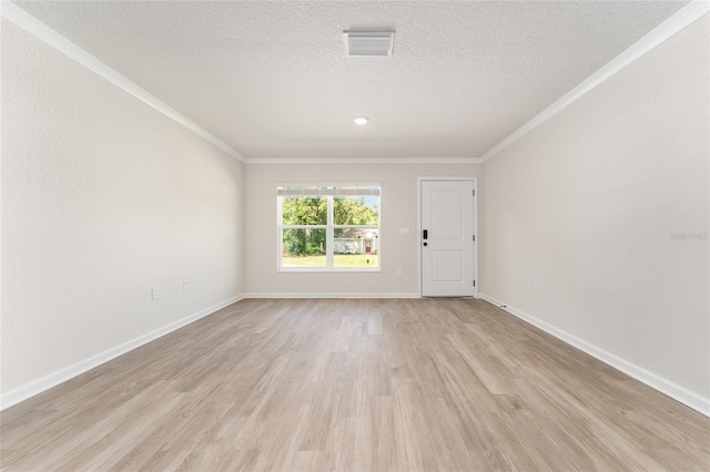 9011 N Travis Dr, Citrus Springs, FL 34434 - spare room with ornamental molding, light wood-style floors, and a textured ceiling