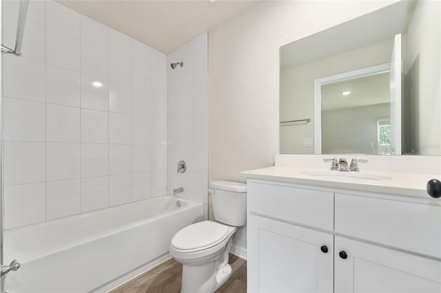 9011 N Travis Dr, Citrus Springs, FL 34434 - full bath featuring vanity, tub / shower combination, wood finished floors, and a textured wall