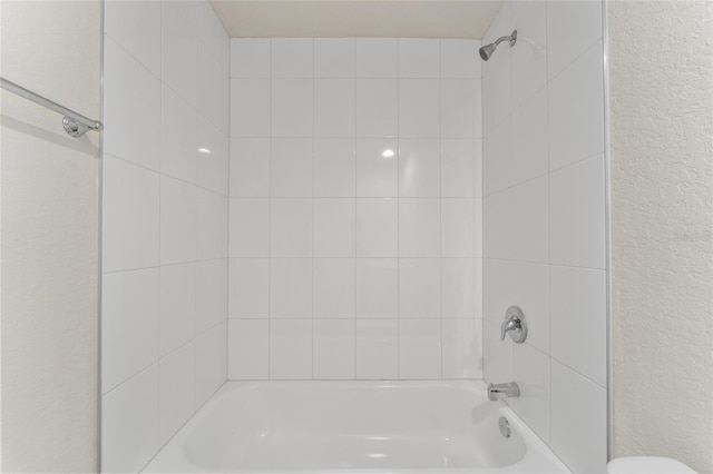 9011 N Travis Dr, Citrus Springs, FL 34434 - full bath with shower / bathtub combination and a textured wall