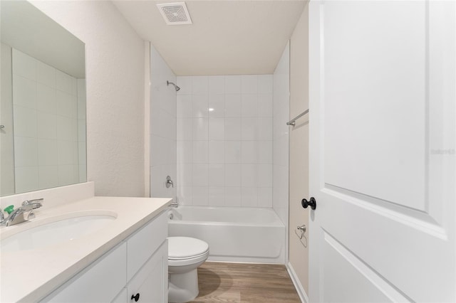 9011 N Travis Dr, Citrus Springs, FL 34434 - full bathroom featuring vanity, wood finished floors, and tub / shower combination