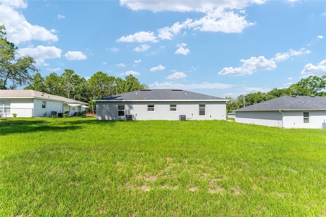 9011 N Travis Dr, Citrus Springs, FL 34434 - back of house with a yard