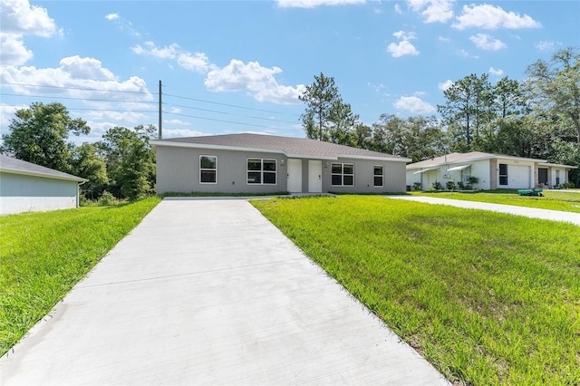 9011 N Travis Dr, Citrus Springs, FL 34434 - single story home featuring a front lawn, stucco siding, and driveway