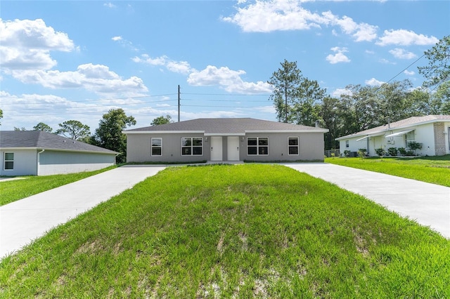 9011 N Travis Dr, Citrus Springs, FL 34434 - ranch-style home featuring a front yard, stucco siding, and driveway