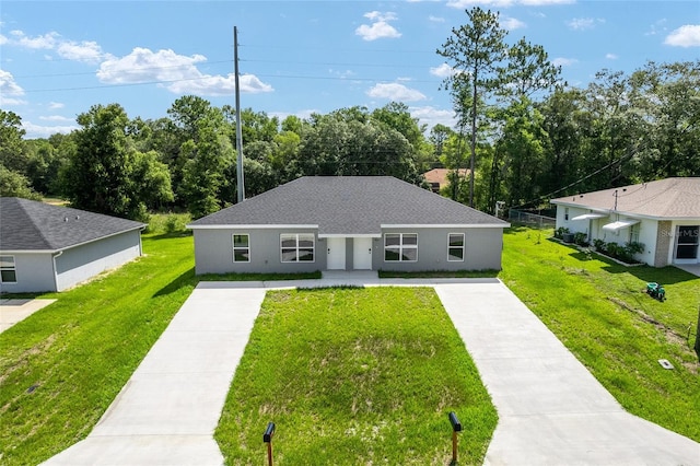 9011 N Travis Dr, Citrus Springs, FL 34434 - view of front of home featuring driveway, a front lawn, stucco siding, and a shingled roof