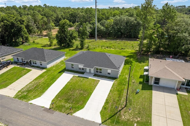9011 N Travis Dr, Citrus Springs, FL 34434 - aerial view of property and surrounding area with a forest