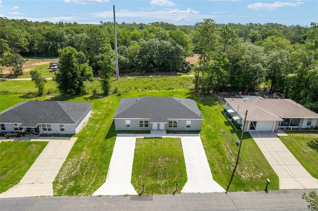 9011 N Travis Dr, Citrus Springs, FL 34434 - view of subject property featuring a heavily wooded area