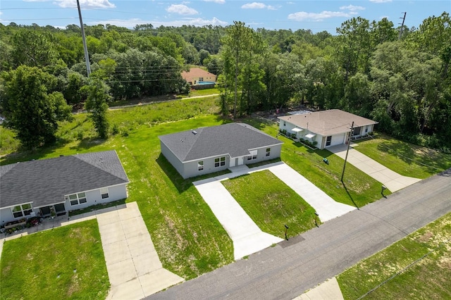 9011 N Travis Dr, Citrus Springs, FL 34434 - view of subject property featuring a heavily wooded area