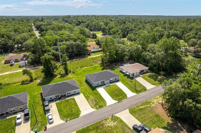 9011 N Travis Dr, Citrus Springs, FL 34434 - aerial perspective of suburban area featuring a heavily wooded area