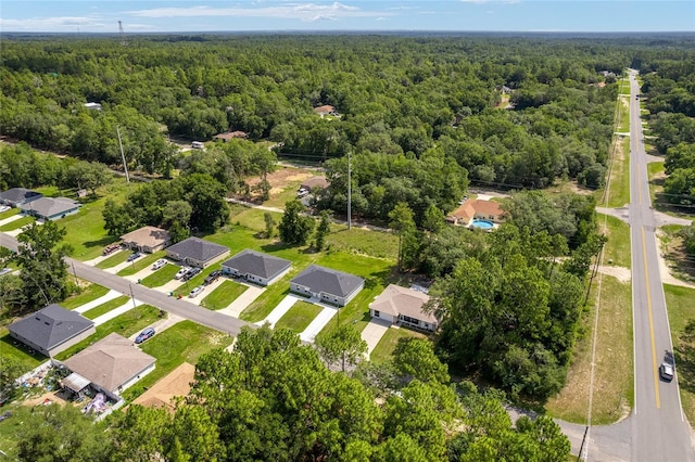 9011 N Travis Dr, Citrus Springs, FL 34434 - aerial view of residential area with a heavily wooded area